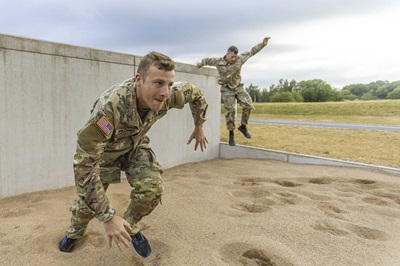 Army Reserve Sgt. Conner Williams trains on an obstacle course.